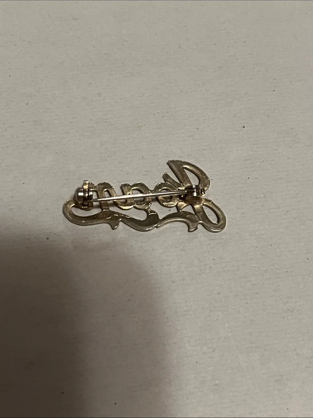 Silver tone ‘Joan’ pin